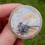 Load image into Gallery viewer, original painting of the renowned shipwreck in Co Donegal is delicately presented as an antiqued silver plated bezel brooch. Created by Northern Irish artist Caroline Dilworth,
